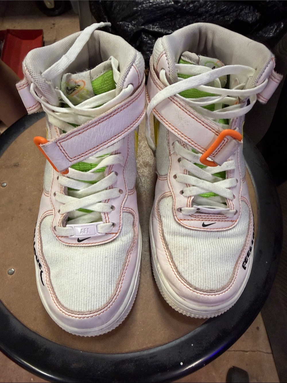 Nike women’s White and Pink High-Top Sneakers with Lime and Orange Accents